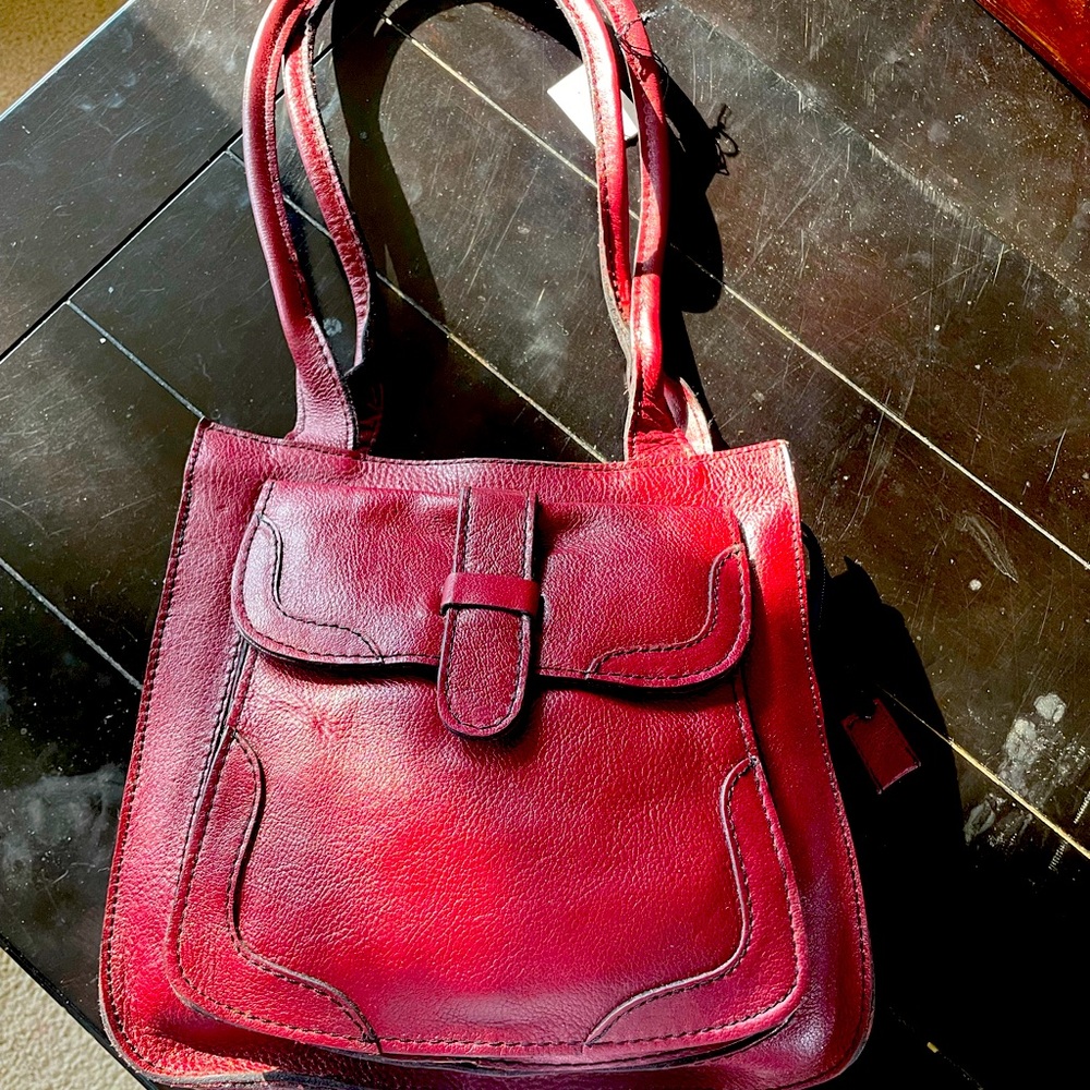 Leather red/burgundy shoulder bag from 1970s new with tags.